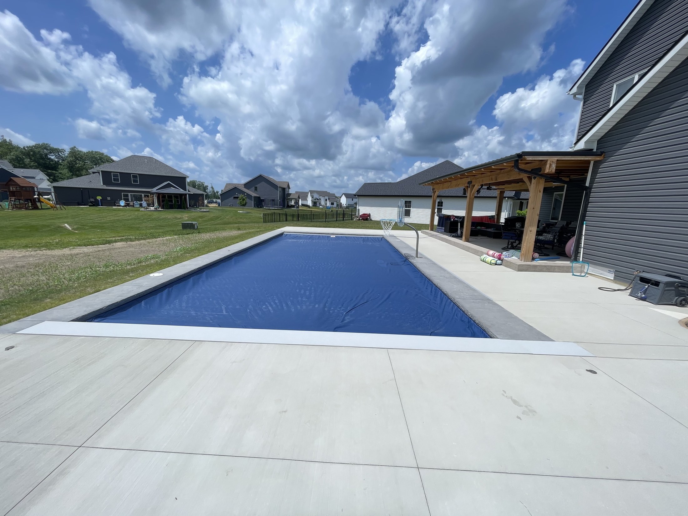 Huntertown pool with covered patio