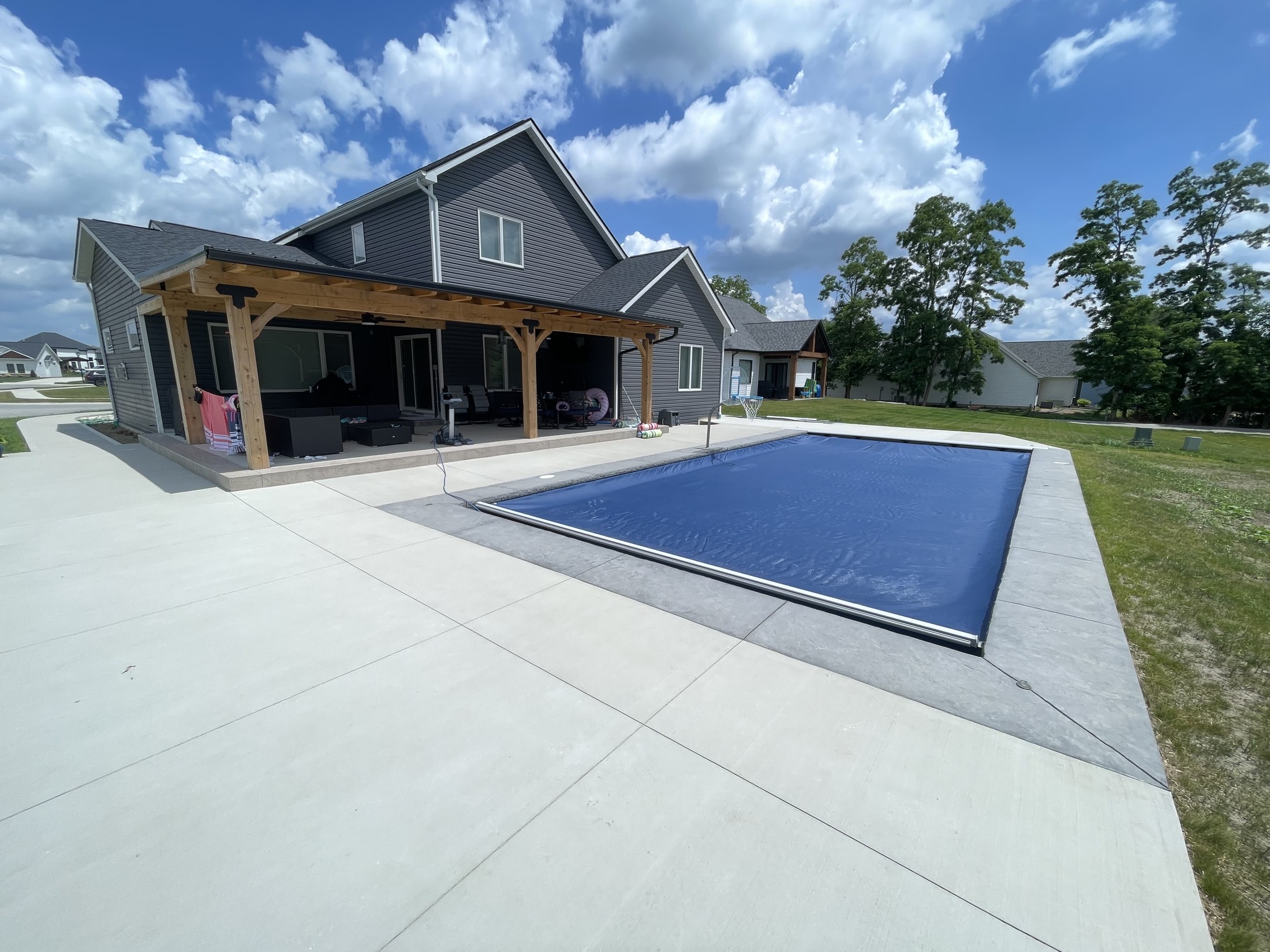 Huntertown pool and covered patio in daylight